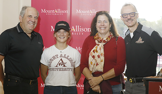 David Booth, Morgan Lundin, Betty-Jo Booth, and Dr. Boudreau during Homecoming 2018.